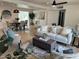Inviting living room with a neutral color palette, stylish furnishings, and an open dining area at 6923 E Hubbell St, Scottsdale, AZ 85257