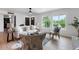 Bright living room with large windows, neutral furniture, and hardwood floors at 6923 E Hubbell St, Scottsdale, AZ 85257