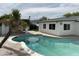 Inviting pool area with a palm tree and views of the backyard, perfect for relaxing and entertaining at 6923 E Hubbell St, Scottsdale, AZ 85257