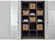 Hallway storage with custom shelving provides ample space and organization, blending functionality with style at 6923 E Hubbell St, Scottsdale, AZ 85257
