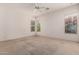 Spacious bedroom featuring carpet, ceiling fan, and natural light at 710 W Cherrywood Dr, Chandler, AZ 85248