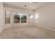 Well-lit bedroom showcasing bright windows and carpet flooring at 710 W Cherrywood Dr, Chandler, AZ 85248