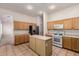 Functional kitchen with ample cabinets, an island, and appliances, perfect for preparing meals at 710 W Cherrywood Dr, Chandler, AZ 85248