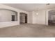 Open-concept living area with archways and carpet flooring, perfect for entertaining and relaxing at 710 W Cherrywood Dr, Chandler, AZ 85248