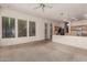 Inviting living room with bright windows and carpet flooring open to a kitchen space at 710 W Cherrywood Dr, Chandler, AZ 85248