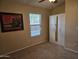 Cozy bedroom with a window view and ample closet space at 7724 W Topeka W Dr, Glendale, AZ 85308