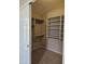 Organized closet featuring shelving and hanging rods for storage solutions at 7724 W Topeka W Dr, Glendale, AZ 85308