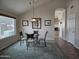 Charming dining area with a glass table and stylish seating arrangement at 7724 W Topeka W Dr, Glendale, AZ 85308