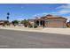 Charming home exterior with a well-maintained yard and a two-car garage at 7724 W Topeka W Dr, Glendale, AZ 85308