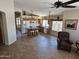 Spacious kitchen with tile flooring, a central island, and an open layout connecting to a casual dining area at 7724 W Topeka W Dr, Glendale, AZ 85308