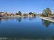 Scenic view of the tranquil lake, enhancing the community's appeal at 7724 W Topeka W Dr, Glendale, AZ 85308
