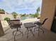 Relaxing patio area overlooking a sparkling pool and lush landscaping at 7724 W Topeka W Dr, Glendale, AZ 85308