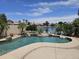 Sparkling pool with a serene waterfall feature offers a refreshing oasis in the backyard at 7724 W Topeka W Dr, Glendale, AZ 85308
