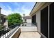 Enjoy the view from this home's balcony, framed by mature trees and showcasing the building's architecture at 8180 E Shea Blvd # 1075, Scottsdale, AZ 85260
