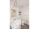 Charming bathroom featuring stylish vanity with marble countertop and decorative mirror and shelving at 8180 E Shea Blvd # 1075, Scottsdale, AZ 85260