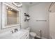 Charming bathroom featuring stylish vanity with marble countertop and decorative mirror and shelving at 8180 E Shea Blvd # 1075, Scottsdale, AZ 85260