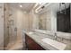 Bathroom features a glass shower with granite countertops and dual sinks at 8180 E Shea Blvd # 1075, Scottsdale, AZ 85260