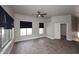 Bedroom featuring hard wood floors, two windows, and a ceiling fan at 8180 E Shea Blvd # 1075, Scottsdale, AZ 85260