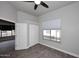 Bedroom with wood floors, a ceiling fan, and a sliding closet at 8180 E Shea Blvd # 1075, Scottsdale, AZ 85260