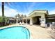 Community pool area featuring lush landscaping, shaded seating, and a perfect spot for relaxation at 8180 E Shea Blvd # 1075, Scottsdale, AZ 85260
