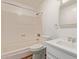 Bathroom featuring a bathtub, toilet, vanity sink, and tiled flooring at 8328 E Chaparral Rd, Scottsdale, AZ 85250