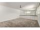 Bright bedroom features a ceiling fan, a mirrored wall and a carpeted floor at 8328 E Chaparral Rd, Scottsdale, AZ 85250