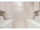 A functional laundry room featuring a washer and dryer at 8328 E Chaparral Rd, Scottsdale, AZ 85250