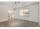 Inviting living space with terracotta tile flooring, views to the kitchen, and plenty of natural light at 8328 E Chaparral Rd, Scottsdale, AZ 85250