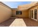 Spacious outdoor patio featuring tiled flooring and a retractable awning at 8328 E Chaparral Rd, Scottsdale, AZ 85250