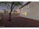 Expansive backyard with a well-maintained landscape, showcasing the home's exterior and a serene outdoor space at 8450 S Stephanie Ln, Tempe, AZ 85284