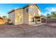 Home's backyard featuring a covered patio, offering a comfortable outdoor living space and relaxation at 8450 S Stephanie Ln, Tempe, AZ 85284