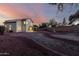 A well-kept backyard featuring a two-story home, a serene fountain, and ample space for outdoor activities at 8450 S Stephanie Ln, Tempe, AZ 85284