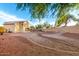 Expansive backyard featuring mature trees, gravel landscaping, and a central fountain, perfect for outdoor enjoyment at 8450 S Stephanie Ln, Tempe, AZ 85284