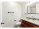 Bathroom features a granite countertop vanity and decorative towel and toilet paper holders at 8450 S Stephanie Ln, Tempe, AZ 85284