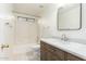 Bathroom with wood vanity, tiled floors, and updated finishes at 8450 S Stephanie Ln, Tempe, AZ 85284