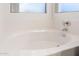 Close up of soaking bathtub with chrome faucet at 8450 S Stephanie Ln, Tempe, AZ 85284