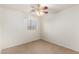 Bright bedroom with natural light, ceiling fan, and carpeted floors at 8450 S Stephanie Ln, Tempe, AZ 85284