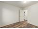 Bright bedroom with wood floors and a view to the kitchen at 8450 S Stephanie Ln, Tempe, AZ 85284