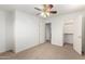 Carpeted bedroom with open doors and closet for organized living at 8450 S Stephanie Ln, Tempe, AZ 85284