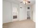 Spacious bedroom with ceiling fan and open entrance to bathroom at 8450 S Stephanie Ln, Tempe, AZ 85284