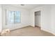 Bedroom featuring a window, closet, and carpet at 8450 S Stephanie Ln, Tempe, AZ 85284