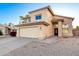 Inviting two-story home boasting a tile roof, two-car garage, and desert-friendly landscaping at 8450 S Stephanie Ln, Tempe, AZ 85284