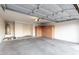 Spacious garage interior featuring ample storage cabinets, a water heater, and a clean, organized space at 8450 S Stephanie Ln, Tempe, AZ 85284