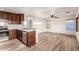 Updated kitchen featuring stainless steel appliances, light granite countertops, and wood floors at 8450 S Stephanie Ln, Tempe, AZ 85284