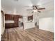 Open-concept living room and kitchen featuring wood floors and modern stainless steel appliances at 8450 S Stephanie Ln, Tempe, AZ 85284