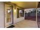 Cozy covered patio area with a view to the landscaped backyard, creating a perfect spot for outdoor living at 8450 S Stephanie Ln, Tempe, AZ 85284