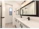 Modern bathroom featuring double sinks, quartz countertops, and black hardware at 8500 E Southern Ave # 550, Mesa, AZ 85209