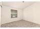 Neutral bedroom featuring carpet and a window for natural light at 8500 E Southern Ave # 550, Mesa, AZ 85209