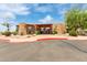 Beautiful clubhouse with a red canopy, desert landscaping, and inviting entrance creates a welcoming community at 8500 E Southern Ave # 550, Mesa, AZ 85209