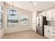 Bright dining area features contemporary chandelier, many windows, and plank flooring at 8500 E Southern Ave # 550, Mesa, AZ 85209